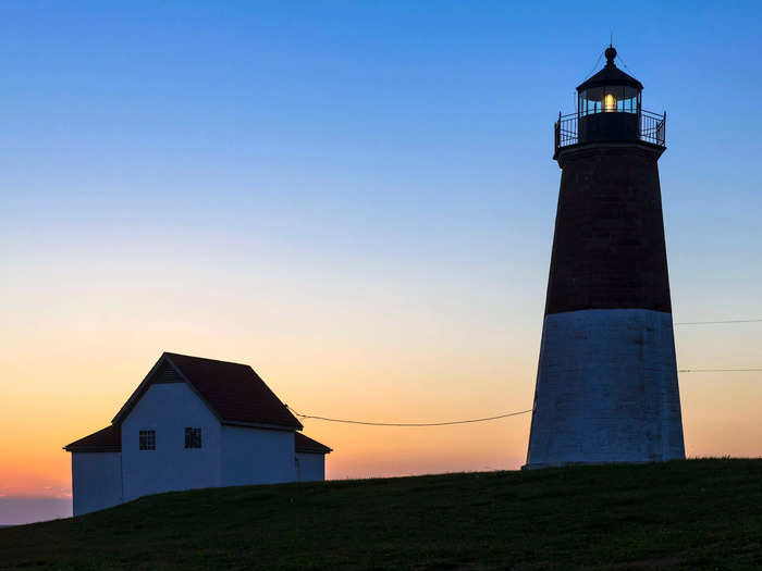 Early sunsets in Rhode Island make for stunning autumn coastal views.