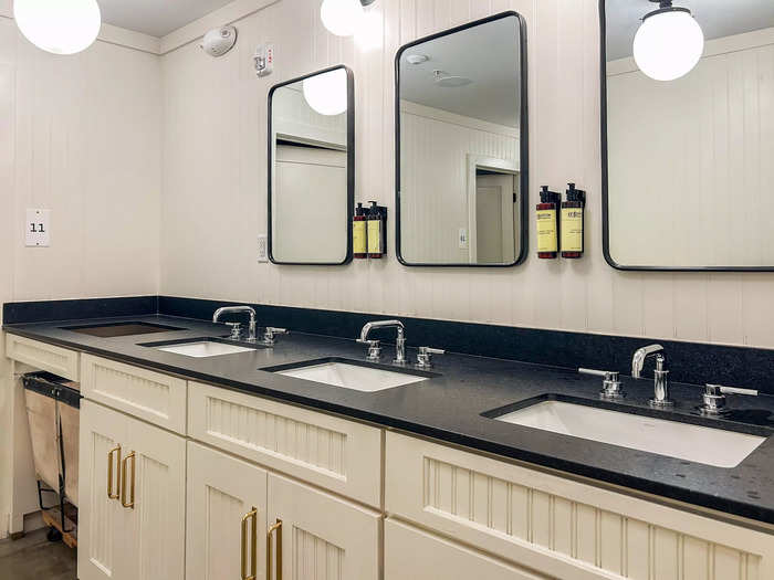 The lockers were next to the bathroom, which had modern built-ins, bright lighting, and high-end toiletries.