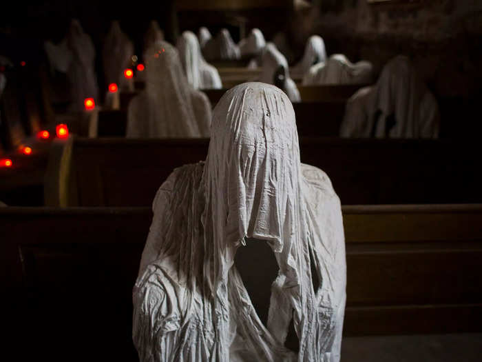 Playing off its haunted history, local artist Jakub Hadrava created 30 life-size "ghosts" to live inside the church.