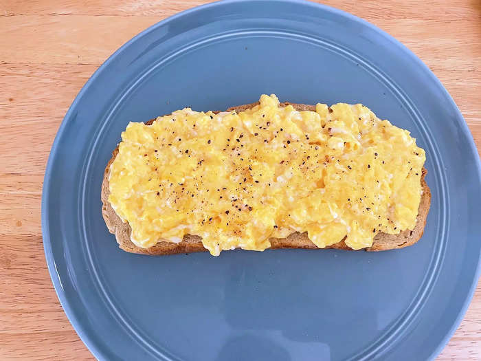 I spread my scrambled eggs on a slice of sourdough and dug in.