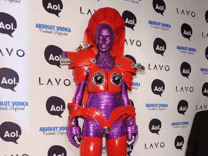 Klum rolled up to the red carpet on stilts and doused in purple paint in 2010.