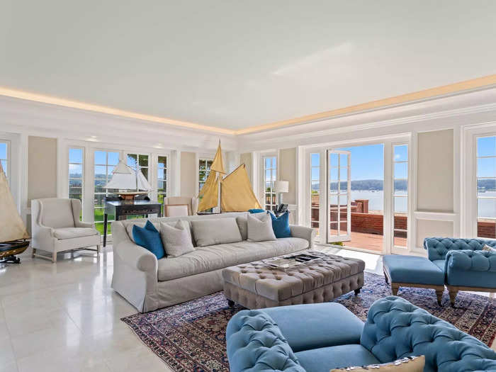 The living room has French doors that open onto the beachfront.