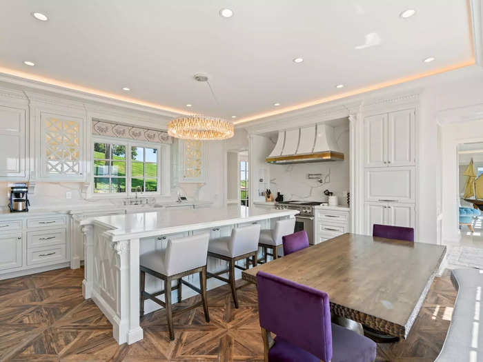 Its kitchen features custom Ciuffo cabinetry and Calacatta quartz countertops.