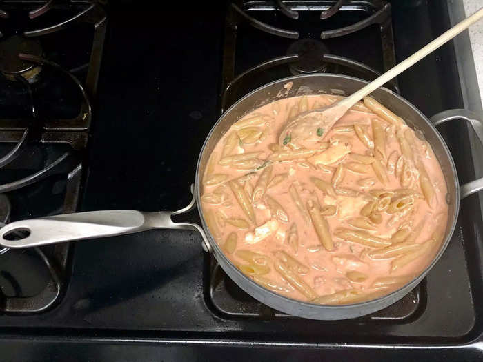 After draining my parboiled noodles, I put them back into the same pot and added my cheesy pink mixture.