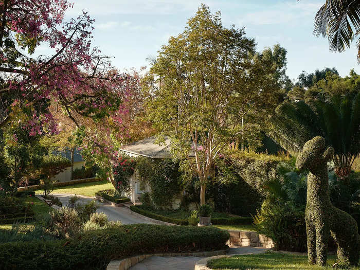 The outside area features formal rose gardens, a vegetable and herb garden, and a tropical botanical garden.