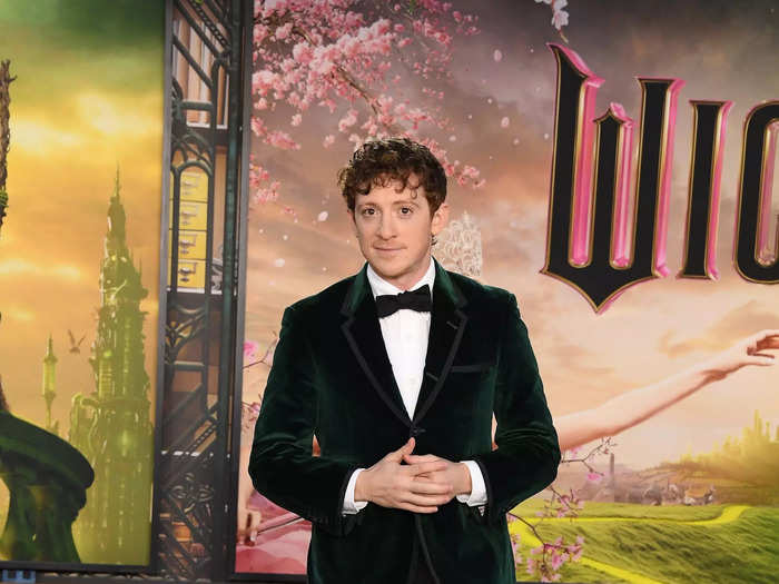 At the LA premiere, Slater embraced "Wicked" green in a velvet blazer.