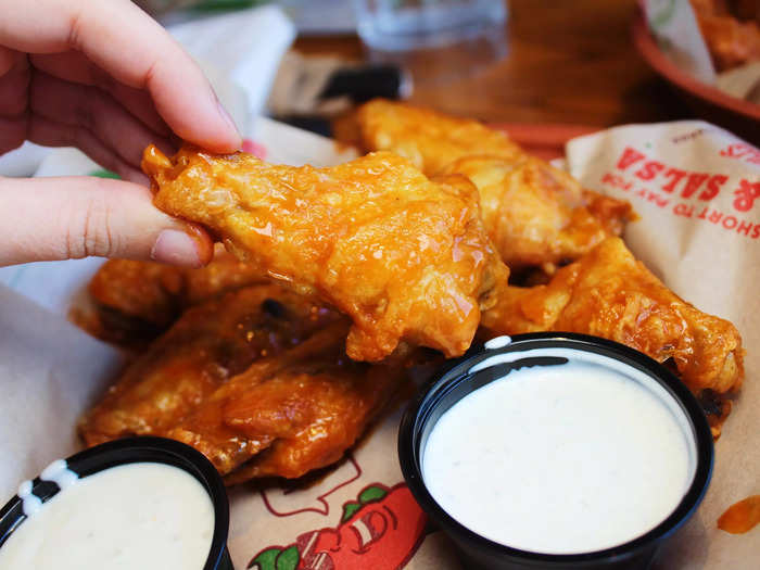 The wings came smothered in Buffalo sauce.