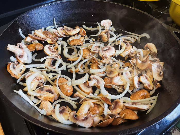 I then chopped and sautéd my vegetables. This recipe calls for a sliced medium-size onion and two cups of sliced mushrooms.