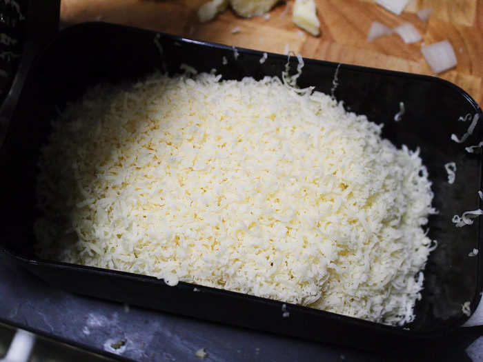 While the onions were cooking, I set about the somewhat grueling task of grating all the cheeses.