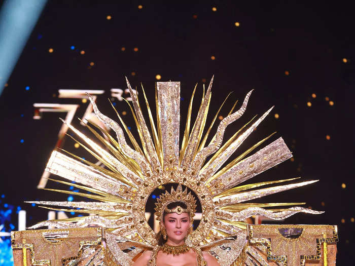 Miss Peru Tatiana Calmell honored the Incan sun god Inti with her golden two-piece and glimmering accessories.