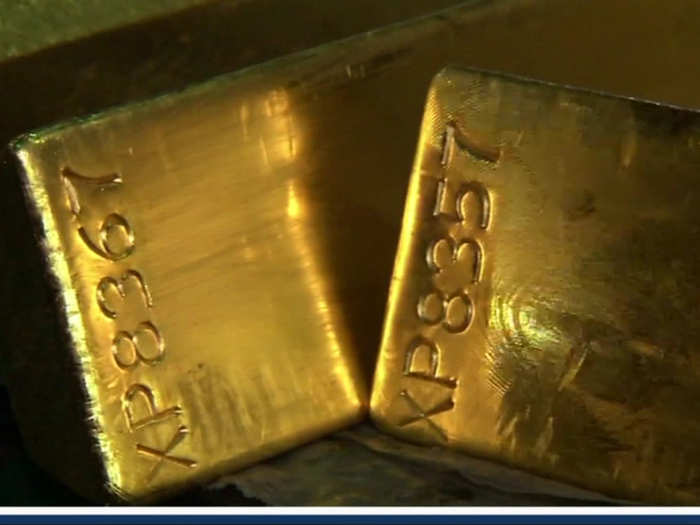 Each gold bar is stamped with a unique identification number...