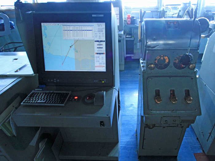 This confluence of old and new is summed up here, with a 21st century navigation system beside an old engine order telegraph from the 1960s that tells the engine room how fast to power the ship through a series of bells