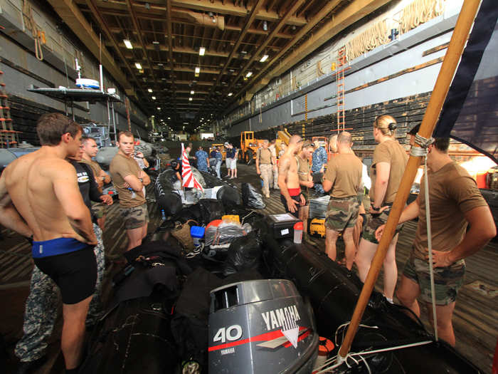 The well deck here is a large part of the reason the Ponce is fitted with all this new gear — it can hold all manner of mine sweeping equipment and troops — Saturday it was filled with international minesweeping divers