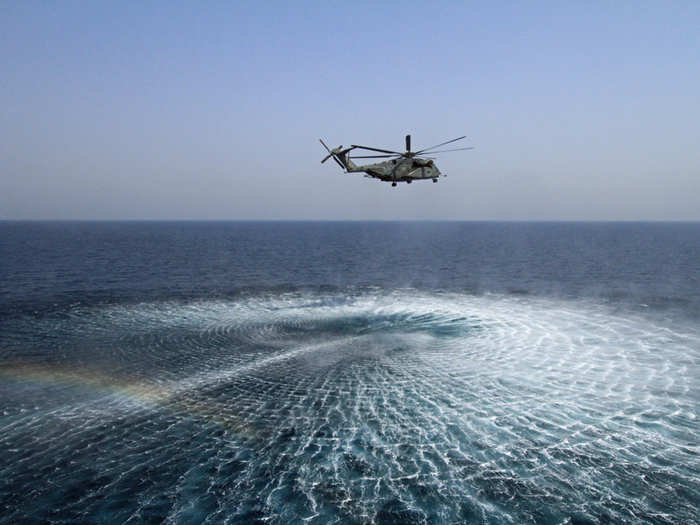 What happens in the well deck happens largely in support of mine clearing efforts like this using specialized helicopters assigned to the ship