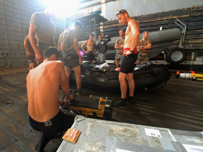 Most mine clearing is done in two parts and almost always requires a dive team — here the French team is prepping for their mission. That