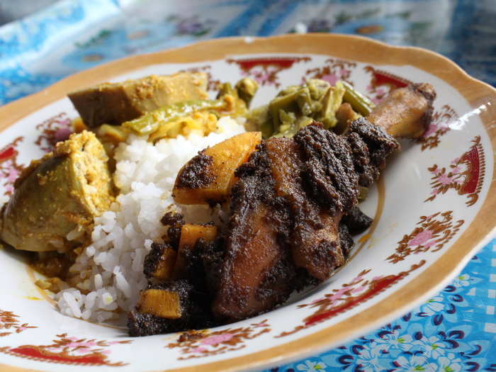 Nasi Kapau is a spicy Indonesian dish with beef jerky, green chili paste, and jackfruit (a cousin to the mulberry) stew served over rice.