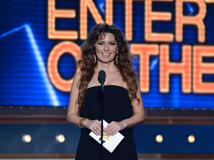 Shania Twain, wearing a superhero outfit, presented Entertainer of the Year to country crooner Luke Bryan.