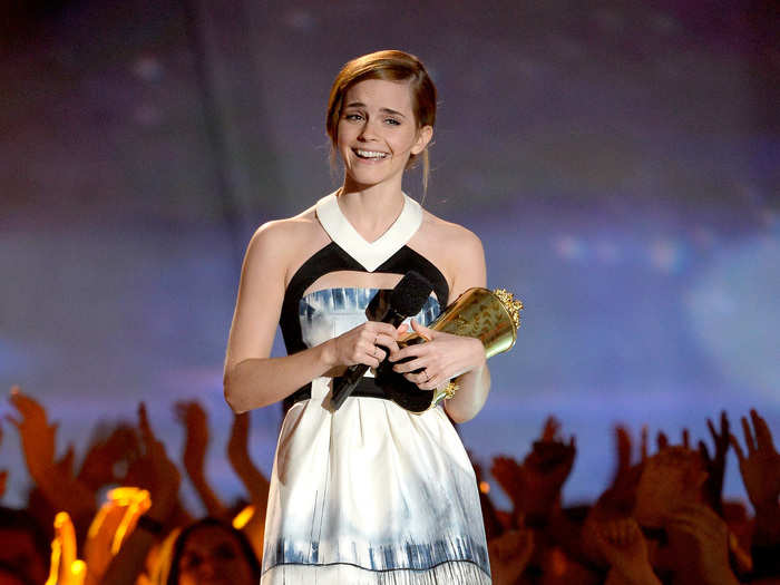 BEST: Emma Watson looked chic in a white and blue dress while accepting the Trailblazer award.