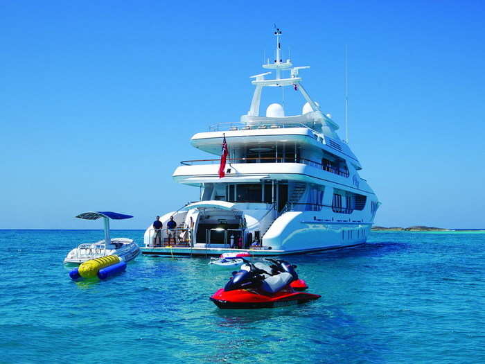 The luxury yacht comes with lots of toys, including a 23-foot motor boat, two jet skis, and scuba equipment.