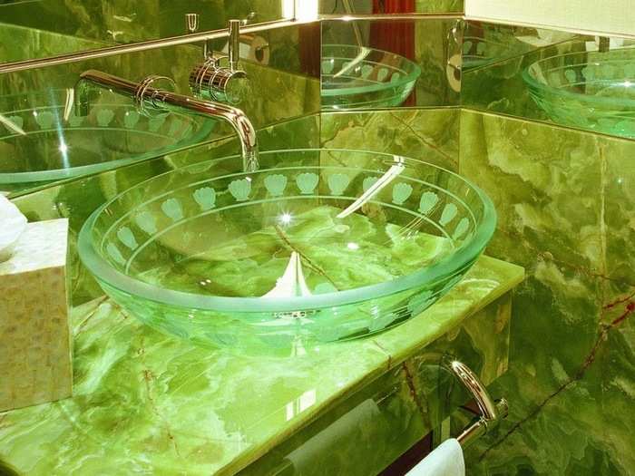 This bathroom features green marble.