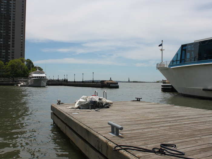 The entrance to the marina has a view of the Statue of Liberty in the distance.