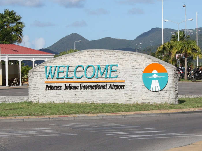 Princess Julianna International Airport is located just meters away on the other side of a short fence.