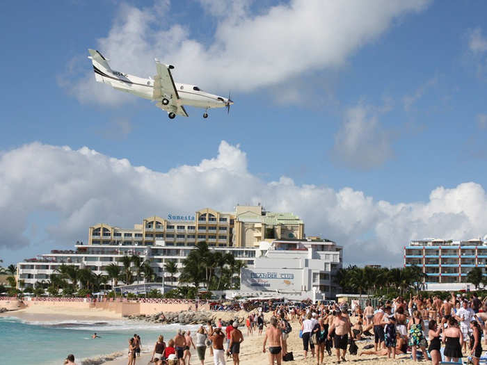 Both small and large commercial planes enter the airport at low altitudes.