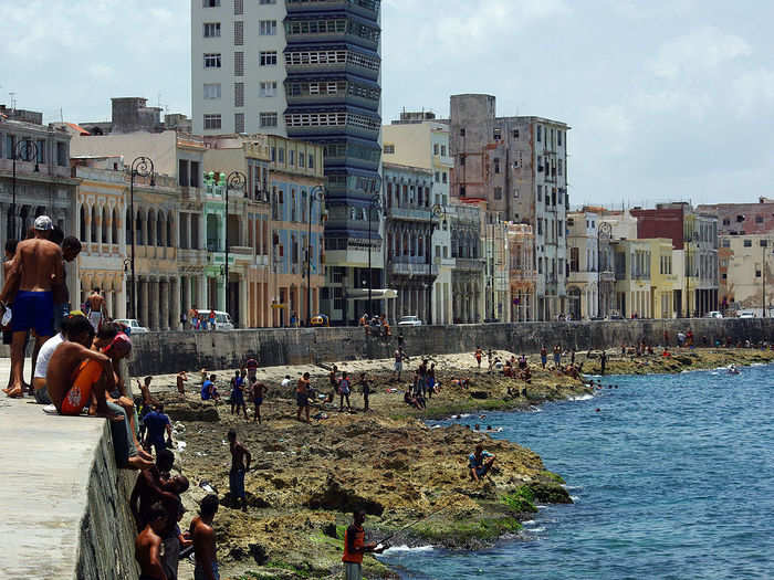 El Malecón is the wall dividing the city from the water. Musicians play, and people walk with their families and pets, taking in the salty air.