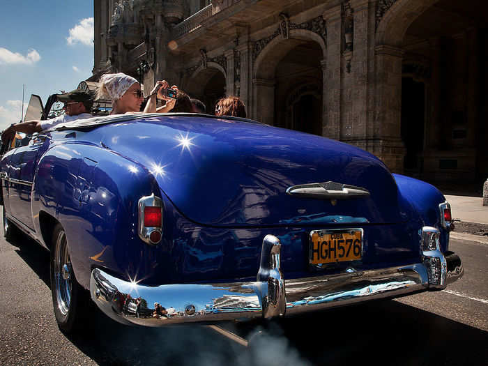 These old cars are especially popular among tourists, who like to cruise in old cars like this 1951 Chevrolet Convertible.