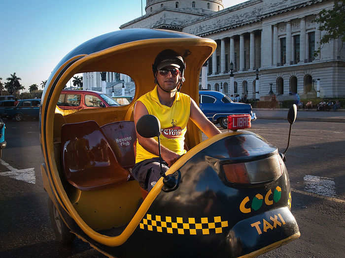 The little yellow "coco taxis" are small, offering seating for two. They