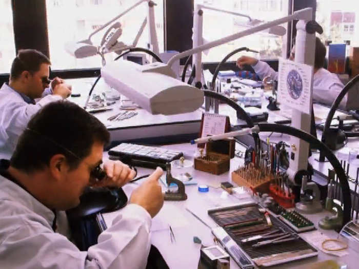 The bulk of the work is done in the Patek Philippe factory, where craftsman carefully assemble each watch at a work station.