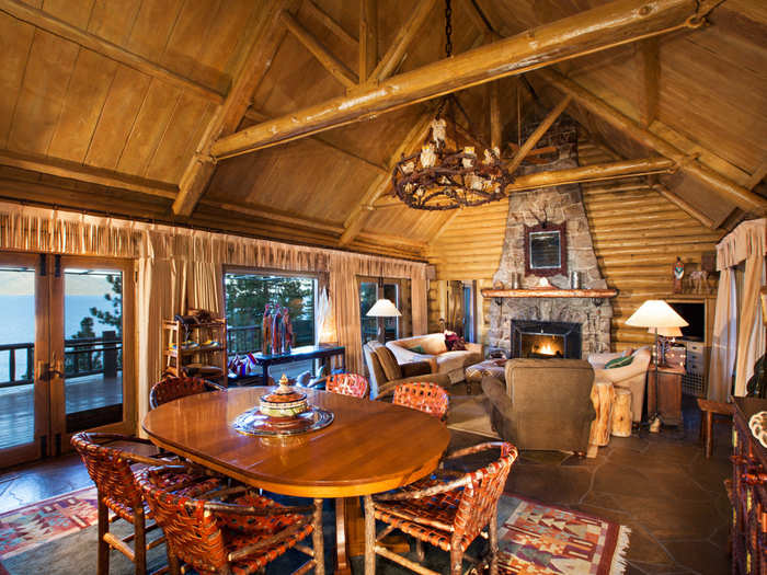 Both the main cabin and the guest house have beautifully finished beams, large windows and stone fireplaces.