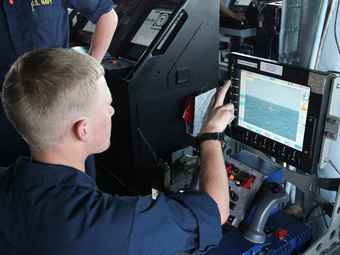 Once the CIWS quiets down, the weapons officer prepares the 20mm cannon for testing. First it is fired remotely with a joystick and camera here on the bridge.