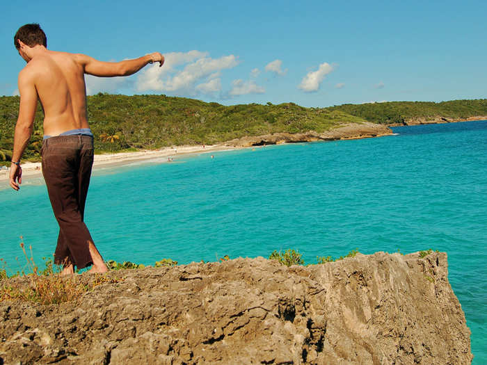 Navio Beach in Vieques, Puerto Rico, has rough waves that attract surfers, rock formations that attract rock climbers, and a cool laid-back vibe that draws a young and hip crowd.