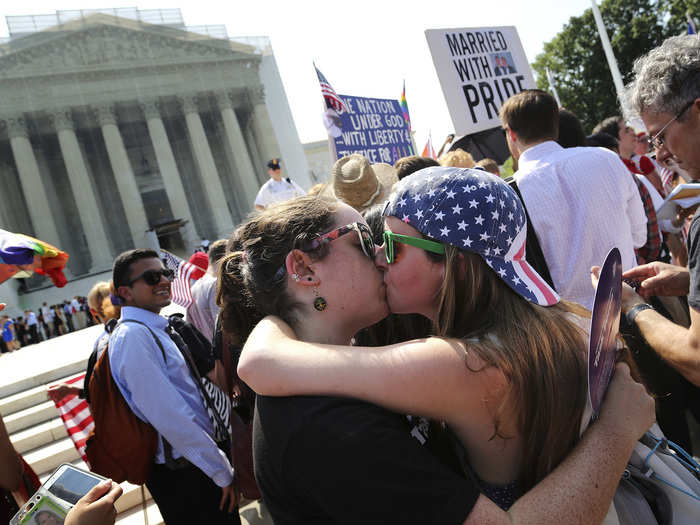 California couple Sarah Beth Alcabes and Meghan Cleary shared a kiss after learning of the decisions.