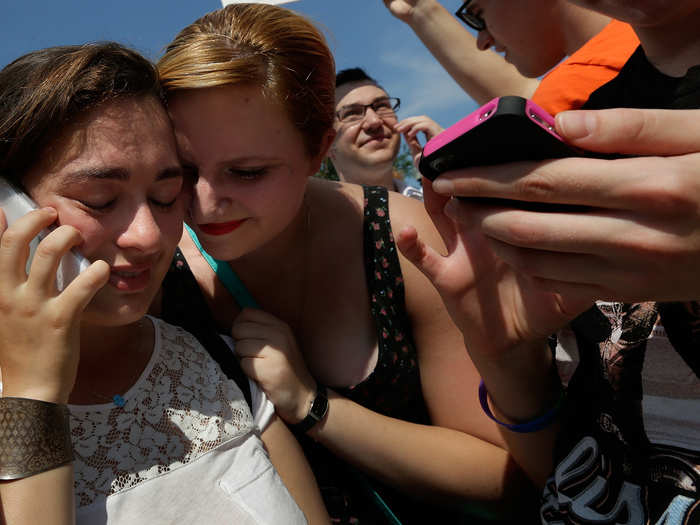 Elana Kessler called her mother as friend Hannah Greenberg embraced her in celebration.