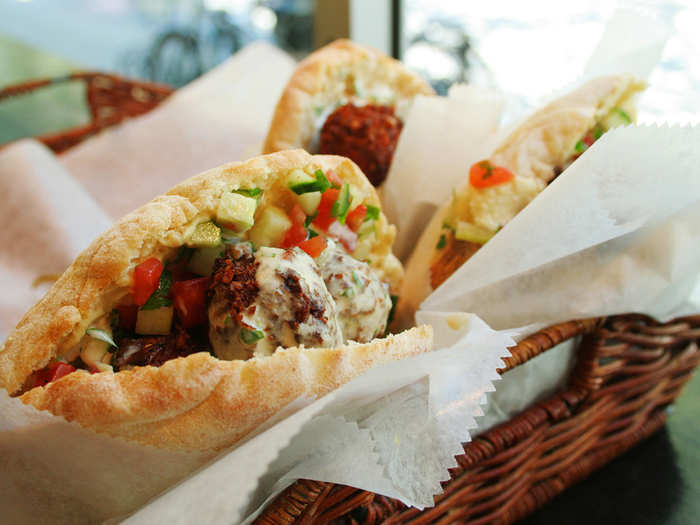 Take a bite out of a crispy, chewy, fresh falafel sandwich overstuffed with vegetables in Tel Aviv, Israel. People swear by the sandwiches at Ratzon Falafel and Gabai Falafel, but you really can