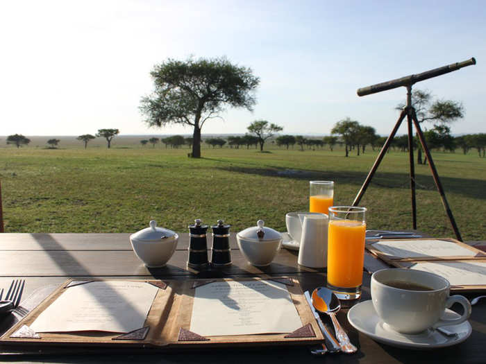 Watch wildebeests from your breakfast table at Singita Grumeti, a luxury camp tent in Africa