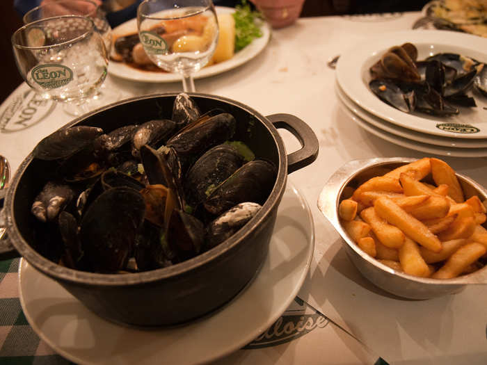 Dig into a steaming bowl of moules-frites in Brussels, Belgium.