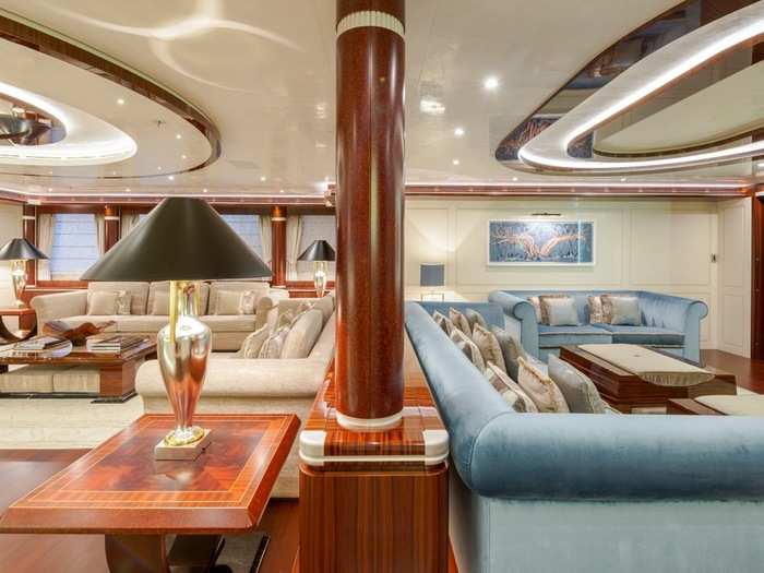 The massive yacht has almost too many extravagant seating areas to count, including these two, which face away from each other and attempt to divide the room into two separate sections.