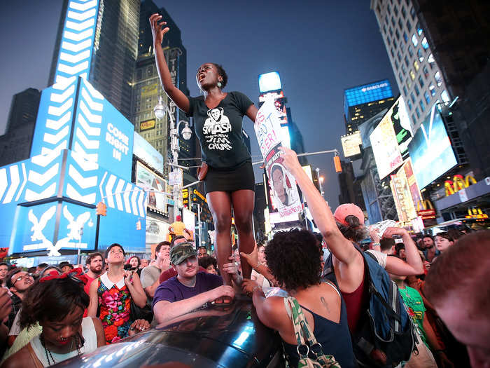 Protesters climbed on top of cars and shouted "no justice, no peace," to protest the verdict. News outlets estimate that between 1,000 and 2,000 people attended the rallies in New York.