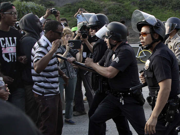 Los Angeles protesters ran afoul of LAPD officers after blocking traffic on the southbound Interstate 10 Freeway. At least one person was arrested after allegedly throwing rocks and bottles at police officers.