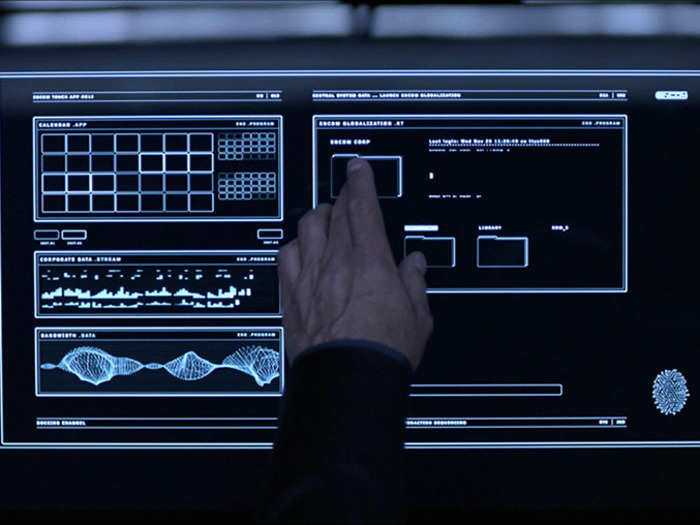 Folder systems are streamlined in the TRON universe, and is that an Apple remote we spy in the lower left?