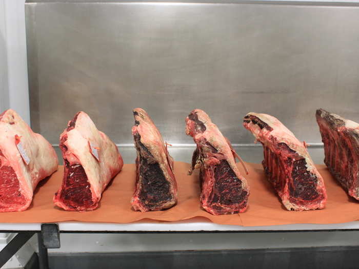 Here you can see enormous pieces of meat at various stages of dry-aging. The meat on the far left is just a day old, while the meat on the far right is nearly 60 days old.