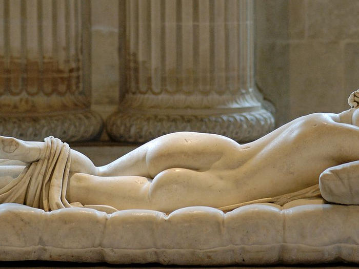 Sleeping Hermaphroditos" Roman copy (2nd Century AD). Mattress by Gianlorenzo Bernini (1619). Mesmerizingly supple-looking, this sculpture is a life size copy of a bronze Hellenistic sculpture. In the 17 brilliant artist Bernini made the cushion so realistic that people are tempted to test its firmness. What is special about this beautiful woman? Click to the next slide or investigate in person.