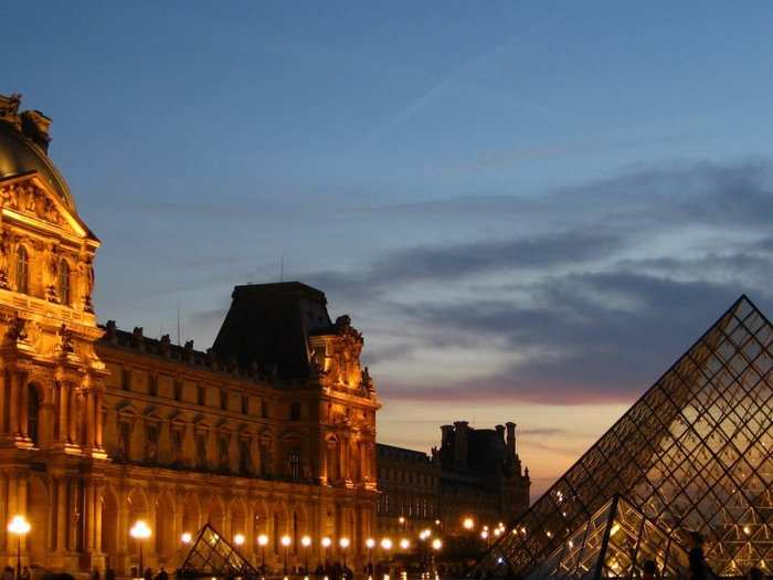 Pyramide du Louvre" by I.M. Pei (1985-1993). "Now a landmark in its own right, I.M.Pei’s glass pyramid was commissioned by President Mitterand and caused a storm of controversy when it opened. It is, however, an ingenious solution to enabling hundreds of thousands of visitors to enter the Louvre by going underground, avoiding the nightmare congestion of the old entryways. By day or by night, it is a glittering gem of the Louvre.