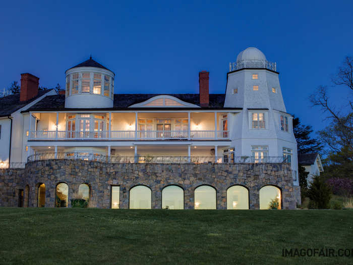 The custom marble terrace is perfect for relaxing with a glass of wine while gazing out at the Long Island Sound.