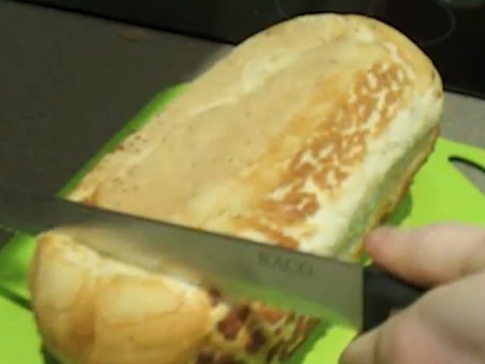 Cut bread from the bottom to avoid squishing it.