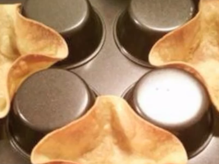 To make tostadas, turn a muffin pan upside down and place soft tortillas in between the cups.