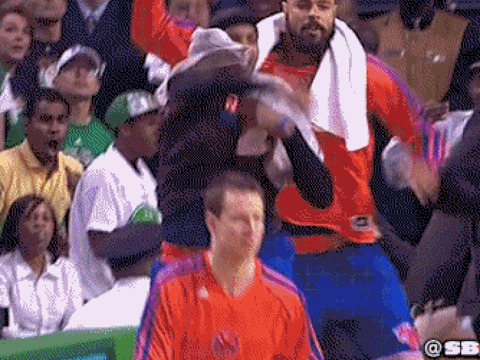 A security guard celebrates behind the Knicks